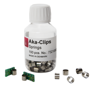 Stainless steel clip for holding small samples while mounting.
