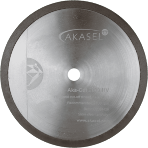 Akasel diamond cut-off wheel Aka-Cut 2000 HV, 150 mm, crafted from silver metal with a dark rim. The disc features text such as "Aka-Cut 2000 HV", "Diamond cut-off wheel, metal bond", "Recommended: 2700 rpm", "Batch: C2024420", and the website address "www.akasel.com". A central hole allows for mounting.